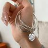 Pulsera de etiqueta metálica multicapa diseño para mujer nicho retro personalidad simple temperamento combinable pulsera de moda pulsera