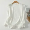 Toma real de blusa casual simple de estilo artístico de ajuste holgado para el verano de 2026, con cuello redondo y mangas cortas tipo volante, estilo japonés relajado para mujer
