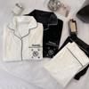 Pijama de pareja de terciopelo dorado de alta calidad con estampado de camelia para mujer, primavera y otoño, negro, manga larga, blanco, traje cárdigan para otoño e invierno