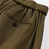 Pantalones casuales de moda para hombre con una caída fluida, que presentan un elegante diseño de cintura, una estética única de corte limpio inspirada en Japón y un corte recto, holgado y de color liso.