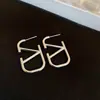 Pendientes de flor de copo de nieve de aguja de plata con circonita y perla, pendientes geométricos de lujo ligero de alta gama, pendientes versátiles y elegantes para mujer