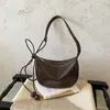 Bolsas Retrô Transfronteiriças Femininas Outono 2026 Nova Pequena Nicho para o Dia a Dia Bolsa de Ombro Única Estilo Coreano Versátil Bolsa Transversal Bolsa Bolinho