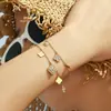 Misterioso conjunto de joyería de acero inoxidable estilo europeo y americano, súper brillante, con circonitas completas, diseño de flor de cuatro hojas, multi-accesorio, pulsera y cadena para clavícula DIY para mujeres