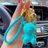Llavero de resina de oso de la suerte de dibujos animados original para mujer, lindo, creativo, exquisito, para llave de coche, colgante de bolso, venta al por mayor