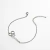 Colgante de Nuevo Producto Transfronterizo con Cuerda Trenzada Ajustable para Mujer, Versátil, Patrón de Tijeras de Acero Inoxidable, Pulsera Lista para la Venta