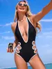 Nuevo traje de baño negro de una pieza calado estilo europeo y americano para mujer, cuello halter con tiras, traje de baño sexy, bestseller transfronterizo