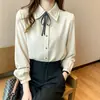 Comercio electrónico transfronterizo, AliExpress: Camisa de primavera/otoño con lazo bordado y detalle de atar, camisa de manga larga para mujer