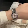 Nuevo Libro Rojo Pequeño TikTok Ola Hogar Corazón Luna Serie Azul Hielo Flor de Cerezo Luna de Daifa Fase Lunar Moda Jialan Reloj de Cuarzo para Mujer