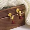 Pendientes de Calabaza Roja de Año Nuevo Otoño e Invierno Retro Nuevos Pendientes de Gama Alta Lujo Accesible Exquisito Elegante Pinza de Oreja de Disco Espiral