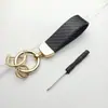 Llavero para coche de hombre de negocios textura avanzada patrón de fibra de carbono llavero para coche eléctrico logo logo logo creativo