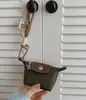 Super Mini Bolso Dumpling 2025 Verano Nuevo Nylon Francés Cuero Monedero Audífonos Lápiz Labial Llaves Pequeño Bolso Colgante Venta al por Mayor