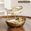 Nuevo Plato de Fruta de Cerámica de Lujo para Uso Doméstico, Estante de Almacenamiento Multicapa para Sala de Estar, Alto Valor Estético, Artesanía Electrochapada, Plato de Frutos Secos con Forma de Yuanbao