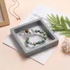Stock listo Caja de suspensión de película de PE al por mayor Caja de joyería Caja de almacenamiento para collares, pulseras y anillos Caja de joyería transparente