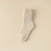 Calcetines de color sólido de comercio electrónico transfronterizo, venta al por mayor de invierno, calcetines altos de tubo gruesos y cálidos para mujer, calcetines de comercio exterior