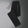 Calça Masculina de Nylon Seda Gelada Nova de Verão Solta de Perna Reta Cordão Secagem Rápida Casual Fina com Caimento Tendência Perna Larga
