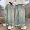 Jeans Rotos para Niños Estilo Primavera y Otoño 2026 Nuevo Estilo Pierna Recta Holgada para Niños Medianos y Grandes Marca de Moda Pantalones Largos Casuales Otoño