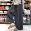 Pantalones de pierna ancha a cuadros pequeños estilo retro coreano de otoño 2026 diseño suelto con cordón que cubre las caderas adelgazantes con caída pantalones casuales