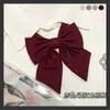 Pajarita de lazo oblicuo de raíz blusa de estudiante [cerdo castaño JK] color liso pluma Joker japonés cuello pequeño flor básico