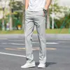 Calças casuais masculinas 2026 novo estilo todas as estações business perna reta soltas cor sólida versátil calças compridas outono calças esportivas masculinas