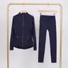 Conjunto de Chaqueta LULU DF con Cuello Alto y Pantalones Cropped con Logo, En Stock, Entrega Directa, Corte Delgado, Transpirable, Chaqueta Elástica con Cremallera Dorada