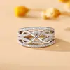 Anillo de Moda para Mujer de Material Ecológico Figura 8 Bicolor Europeo y Americano Venta Caliente Transfronteriza Galvanizado Nuevo Multicapa Venta al por Mayor de Fábrica