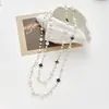 Colección Larga de Collares Superpuestos de Perlas Swarovski para Mujer, Estilo Lujo Ligero, Cadena Versátil para Suéter con un Toque de Alta Gama, Venta al por Mayor Otoño e Invierno
