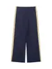 Chamarra de moda europea y americana transfronteriza con bloques de color, tela técnica, acentos de franjas laterales y pantalones casuales