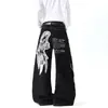 Jeans de calle estilo americano ligeros con estampado de graffiti de alas y costuras de contraste, pantalones de algodón unisex de pierna ancha curvada multibolsillos hasta el suelo