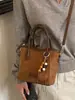 Bolsa de Mão de Pelúcia Camurçada Feminina 2026 Nova Outono Retro para o Trabalho Bolsa de Ombro Único Bolsa Saco Maillard Transversal