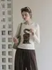 Camiseta feminina estilo coreano, cor damasco, gola redonda, manga longa, com estampa outono 2026, pode ser usada como peça externa