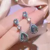 Comercio Exterior Transfronterizo Exquisita Joyería Incrustada con Diamante Azul Gota de Agua Collar Pendientes Anillo para Mujer Juego de Tres Piezas Colgante de Joyería Venta al por Mayor