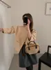 Novo casaco de lã dupla face 2026, modelo curto, inspirado na Chanel, gola redonda, projetado para figuras petites, espessado para aquecimento, peça de outer wear de caxemira