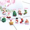 Calcetines de Navidad de resina muñeco de nieve Papá Noel accesorios horquilla goma elástica accesorios funda para teléfono móvil diy al por mayor