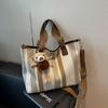 Bolsa de Lona Estilo Novo 2026 Transfronteiriça para Mulheres, Grande Capacidade, Bolsa de Ombro Fashion e Versátil, Bolsa Transversal para Aula e Trabalho, Bolsa Tote Tendência
