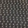 Jiaxin textil otoño e invierno Nuevo tela base imitación mezclilla tela con lentejuelas bordado plano 3MM bordado Campanilla bordado tela para mujer