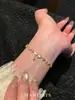 Pulseira de Meteoro com Laço para Mulheres, Design de Nicho com Toque de Luxo, Estilo Simples e Minimalista, Luxo Leve, Acessório Popular de Verão