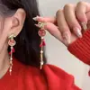 Brincos Trazedores de Sorte de Ano Novo para Mulheres 2026 Novos Populares Vermelhos Festivos Brincos de Tarraxa Design Único Brincos de Luxo