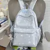 Nuevo modelo 2026 mochila casual estampada estilo ins para estudiantes de secundaria y primaria, mochila ligera de gran capacidad para ir a la escuela para niñas
