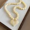 Collares bohemios de cuentas europeos y americanos para mujer, cadenas para la clavícula de diseño nicho, collares de lujo ligero de alta gama para mujer al por mayor
