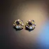 Aretes Púrpuras Vintage con Diseño Floral