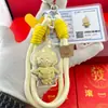 Shuibei Oro Puro 999 Persona Estrella Pop Mart Dibujo Animado Correa para Teléfono Llavero Colgante para Bolso Promoción de Ventas Regalo Venta al por Mayor