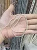 Suministro del fabricante de perlas naturales de agua dulce ultrapequeñas, sin perforar, de 2-2.5 mm para manualidades, un hilo mide aproximadamente 39 cm de largo.