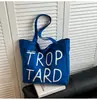Bolso de Lona Casual Estilo Coreano de Color Contrastante para Mujer 2025 Nuevo Bolso de Hombro con Letras para Estudiantes Viajes Cotidianos Bolso de Mano Simple Versátil
