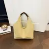 Bolso de mano casual estilo coreano 2026 nuevo modelo bolso de hombro para el trabajo y los desplazamientos, bolso de mano elegante de lona de color liso único