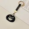 O chaveiro de couro mais vendido da Amazon, com abóbora de Halloween totalmente cravejada de diamantes, um pingente de bolsa de alta qualidade e requintado cravejado de diamantes