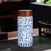 Fabricantes de origen de taza térmica de cerámica Jingdezhen taza térmica de porcelana azul y blanca taza de regalo para la salud taza de burbujas logotipo