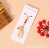 Nuevo cordón para teléfono móvil con amuleto de bendición estilo chino con varios mensajes de bendición, artesanía de aleación con goteo de aceite, colgante para bolsa pequeña, venta al por mayor