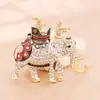 [Liquidación] Broche de flor de pavo real con diamantes de comercio exterior europeo y americano, pines de gatito bailando, accesorios para ropa de hombre y mujer