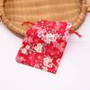 Fabricante en stock ins bolsa de regalo de algodón de flor de cerezo caramelo cordón bolsa con cordón bolsa de embalaje de regalo bolsa de almacenamiento dorada
