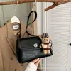 Moda japonesa y coreana minimalista de alta gama gran capacidad para el día a día 2026 bolso de hombro cruzado para mujer otoño nuevo bandolera para el antebrazo